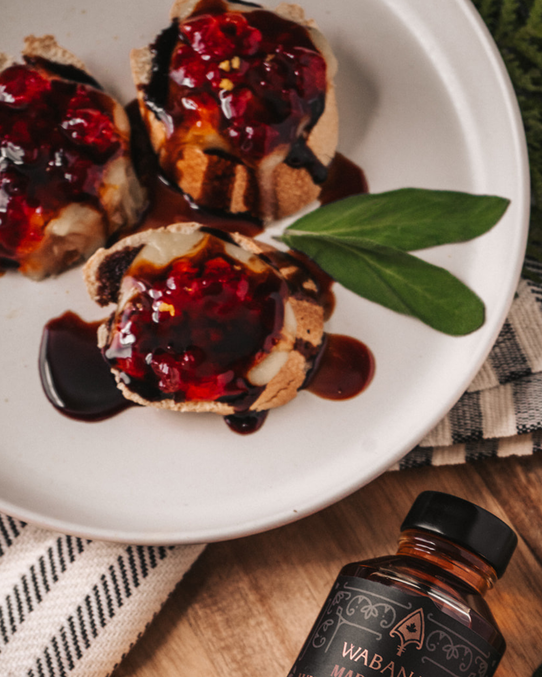 Maple Balsamic Brie pictured with Wabanaki Maple. 100% Traditional, Indigenous maple syrup